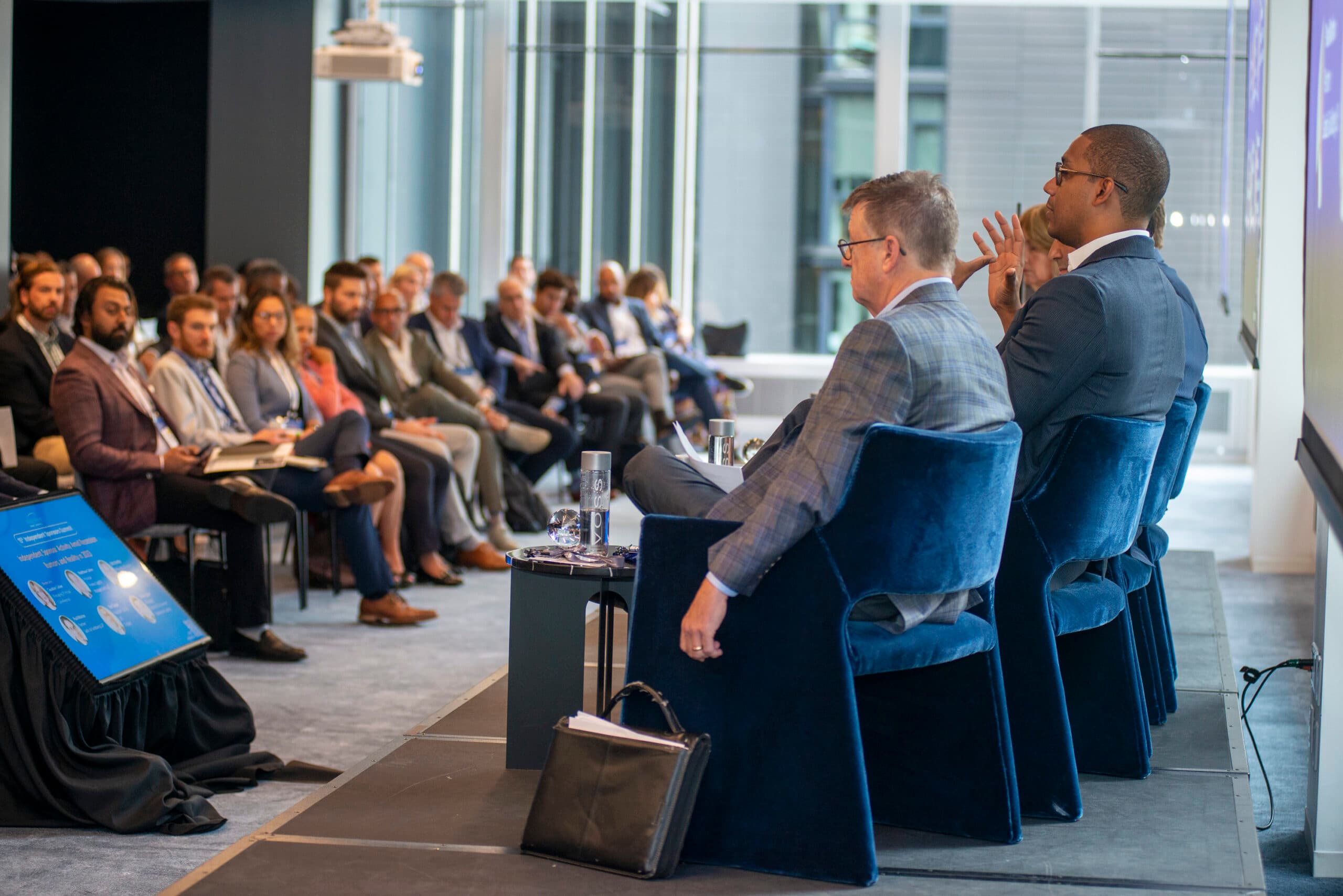 iGlobal Forum speakers in conversation with senior dealmakers at an event